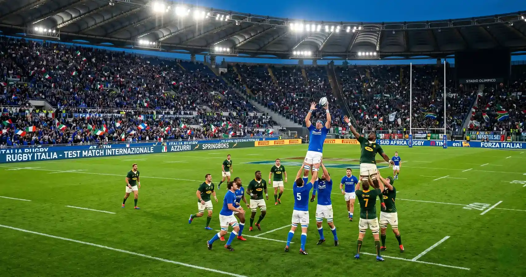 Stadio di rugby gremito durante una partita internazionale con tifosi sugli spalti